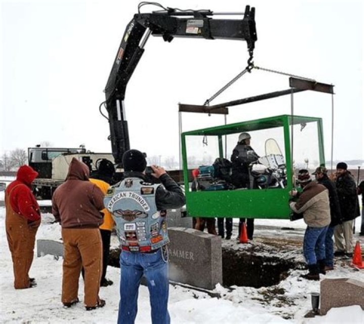 Dead Biker Buried Astride Harley in Clear Casket